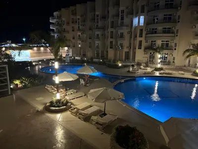 an overhead view of a swimming pool at night at Princess resort in Hurghada