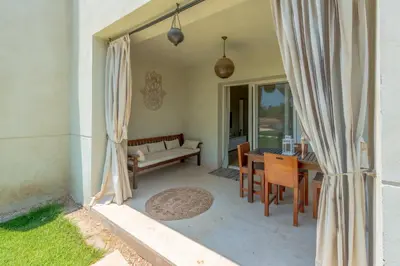 a living room with a couch and a table at 1-Bedroom Apartment in Joubal with nice Pool in Hurghada