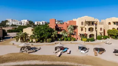 an aerial view of a resort with tables and umbrellas at 3-Bedroom Apartment - Great location- Upper Nubia in Hurghada