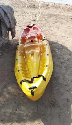 a yellow kayak sitting on top of the beach at The Seafront Magical Loft! in Hurghada