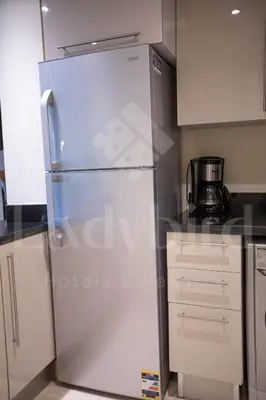 a stainless steel refrigerator in a kitchen at Ladybird - Veranda Skyline in Hurghada