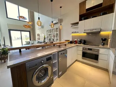 a kitchen with a washer and dryer in it at Charming 3BR Villa/Free Pool & Lagoon Access@Gouna in Hurghada