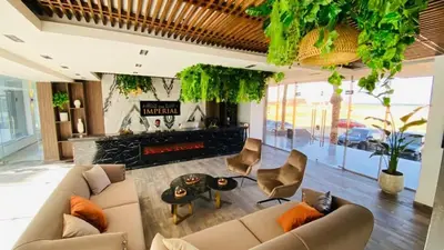 a living room with a couch and a table at Imperial Resort Apartment XL 1 Bed in Hurghada