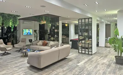 a living room with a couch and chairs and a table at Imperial Resort Apartment XL 1 Bed in Hurghada