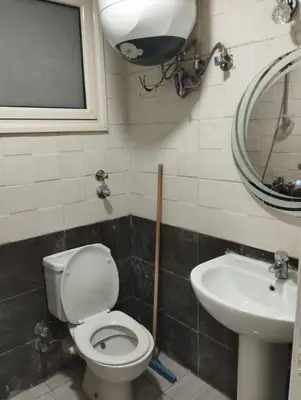 a bathroom with a toilet and a sink at plaza hurgahda in Hurghada