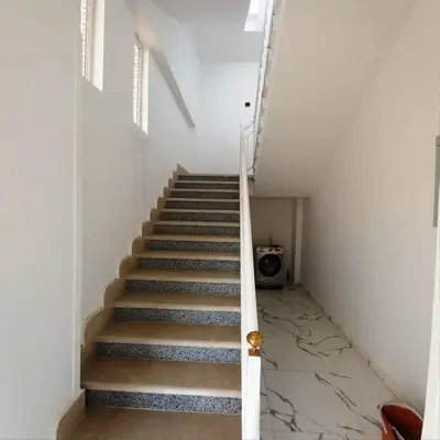 a staircase in a house with a stair case at Al Baba Nile Villa in Luxor