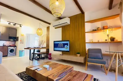 a living room with a couch and a coffee table at Cozy 3 bedrooms in swan lake in Hurghada