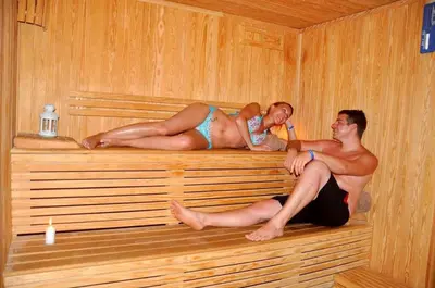 a couple of people laying in a sauna at Rohanou Beach Resort in Quseir
