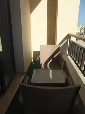 a table and chairs sitting on a balcony at Sky Relax ALDAU HEIGHTS in Hurghada