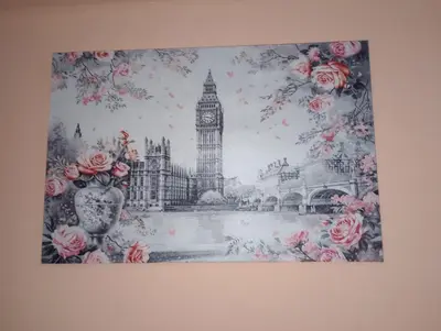 a picture of big ben with pink roses at ALHASANI APARTMENT in Hurghada