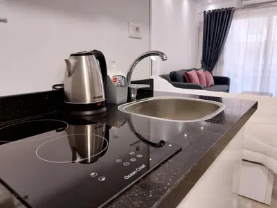 a kitchen with a sink and a mixer on a counter at Florenza Khamsin Resort Hurghada in Hurghada