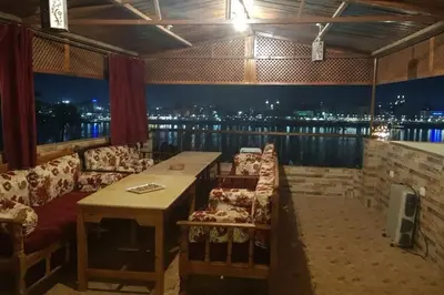 a room with a couch and a table with a view at Elminaa Residents 2 in Luxor