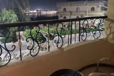 a balcony with a view of a building at Elminaa Residents 2 in Luxor