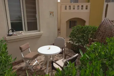 a patio with a table and chairs and a table and chairs at Captivating 1-Bed Apartment in hurghada in Hurghada