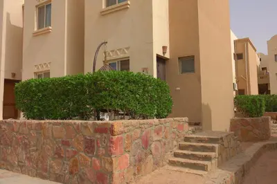 a stone wall in front of a building at Captivating 1-Bed Apartment in hurghada in Hurghada
