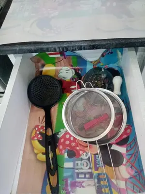 a table with a whisk and other items in a box at Family-friendly apartments in Hurghada in Hurghada