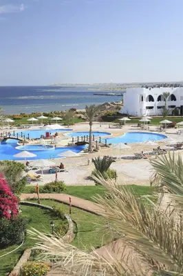 an aerial view of a resort with several pools at Three Corners Equinox Beach Resort in Abu Dabab