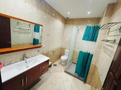 a bathroom with a sink and a shower at Velký apartmán 50 m od pláže s přístupem zdarma- Sahl Hasheesh Hurghada resort Andalusie in Hurghada