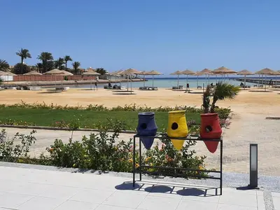 a display of colorful bowls on a rack near a beach at Oscar luxury free WiFi 15 in Hurghada