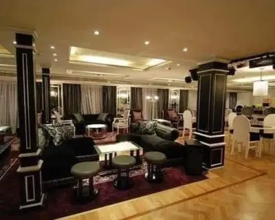 a living room with a couch and tables and chairs at Five Star Nile Cruise from Aswan to Luxor in Aswan