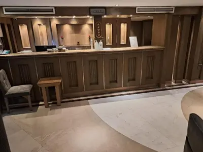 a lobby with a bar with a table and chairs at Five Star Nile Cruise from Aswan to Luxor in Aswan