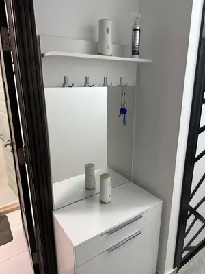 a white cabinet with two cups on top of it at S 22 Marina City in Port Ghalib