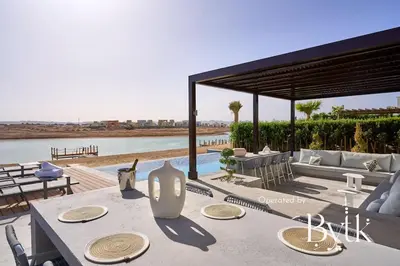 a table with chairs and a view of the water at BYTK - Casamigos in Hurghada