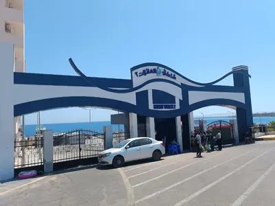 a white car parked in front of a gas station at 2 room Appartement in Hurghada