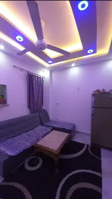 a living room with a couch and a ceiling at Hurghada in Hurghada