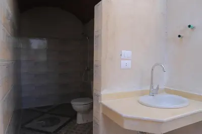 a bathroom with a sink and a toilet at Happy house in Luxor
