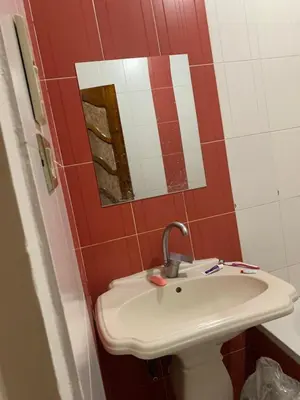 a bathroom with a sink and a mirror at Welcome to LLL (Love Life Luxor) in Luxor