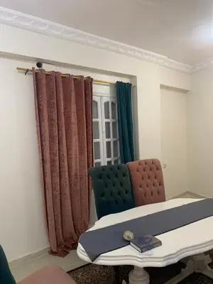 a hospital room with a bed and a chair at Welcome to LLL (Love Life Luxor) in Luxor