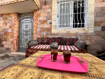 a table with a tray with two glasses on it at Luxor Sun Villa in Luxor