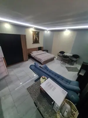 a living room with a bed and a couch at Horizon on Mamsha in Hurghada