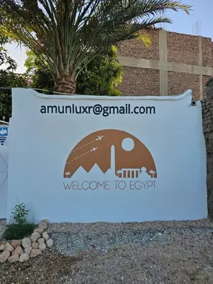 a sign for the entrance to the welcome to epcot at Casa Helvetica in Luxor