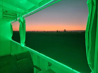 a view from the inside of a train with a green light at Casa Helvetica in Luxor