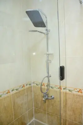 a shower with a laptop on top of a glass door at Luxe Apartment Inside Karma Beach Resort Al Ahiaa-Beach Free Access in Hurghada