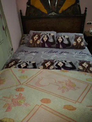 a bed with a group of people on it at مدينة القصير in Quseir