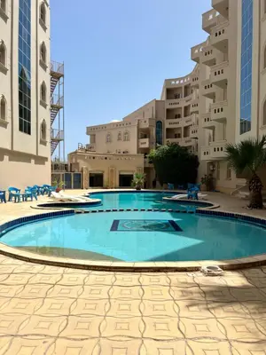 a large swimming pool in the middle of a building at H&H Dream in Hurghada