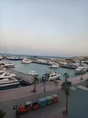 a marina with boats parked in the water at Comfort Marine in Hurghada