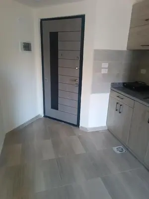 an empty kitchen with a door in a room at Princess resort flat no217 in Hurghada