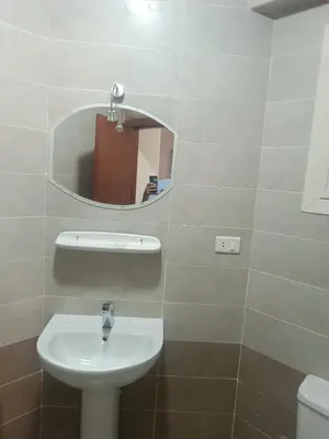 a bathroom with a sink and a mirror at Princess resort flat no217 in Hurghada