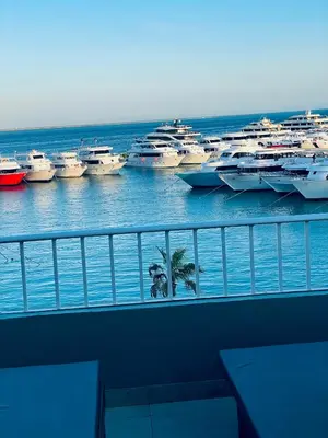 a group of boats parked in a harbor at Marina Suite in Hurghada