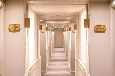 a corridor of a hotel with white halls at Orient Tower Prestige Nile Cruise-Every Monday from Luxor for 04 & 07 Nights - Every Friday From Aswan for 03 Nights in Luxor