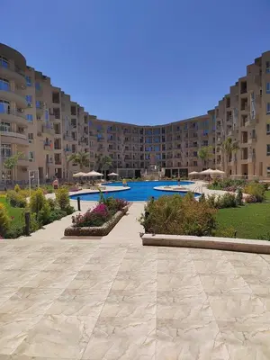 a large apartment complex with a swimming pool and a resort at Princess resort 307 in Hurghada
