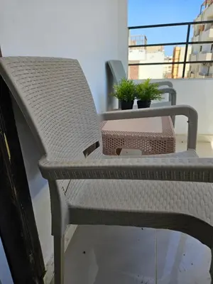 a wicker chair sitting on top of a balcony at الغردقة الدهار القيادات in Hurghada