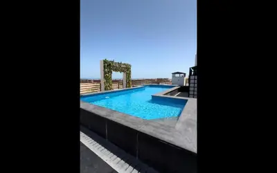 a swimming pool on the roof of a building at Imperial resort in Hurghada