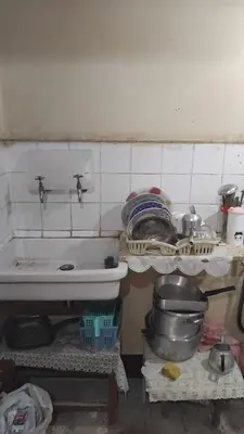a kitchen with a sink and some plates and pans at Pito home in Luxor