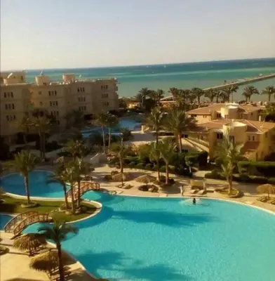 an aerial view of a resort with a large swimming pool at بالما ريزورت in Hurghada