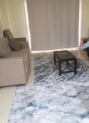 a living room with a couch and a coffee table at بالما ريزورت in Hurghada